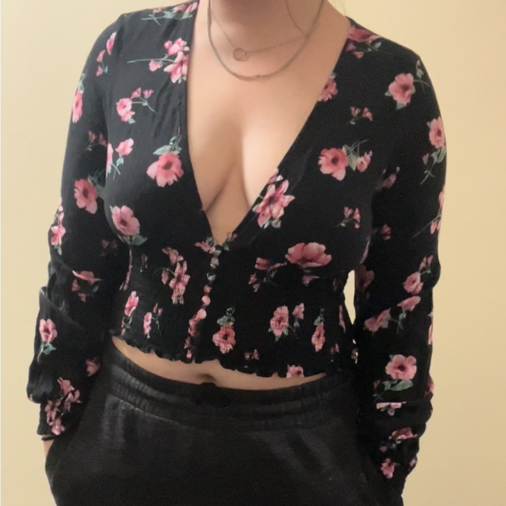 Black and pink floral top. Deep v neckline